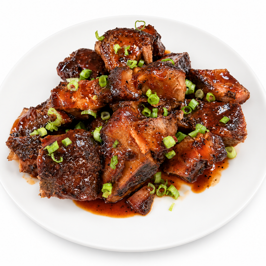 Dre’s Island Flava smoked jerk pork with jerk sauce and green onion garnish